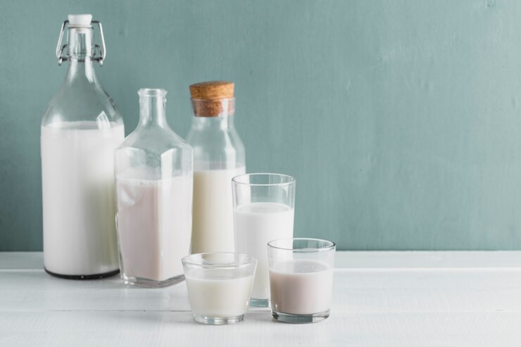 Bottles and Glass full of Milk