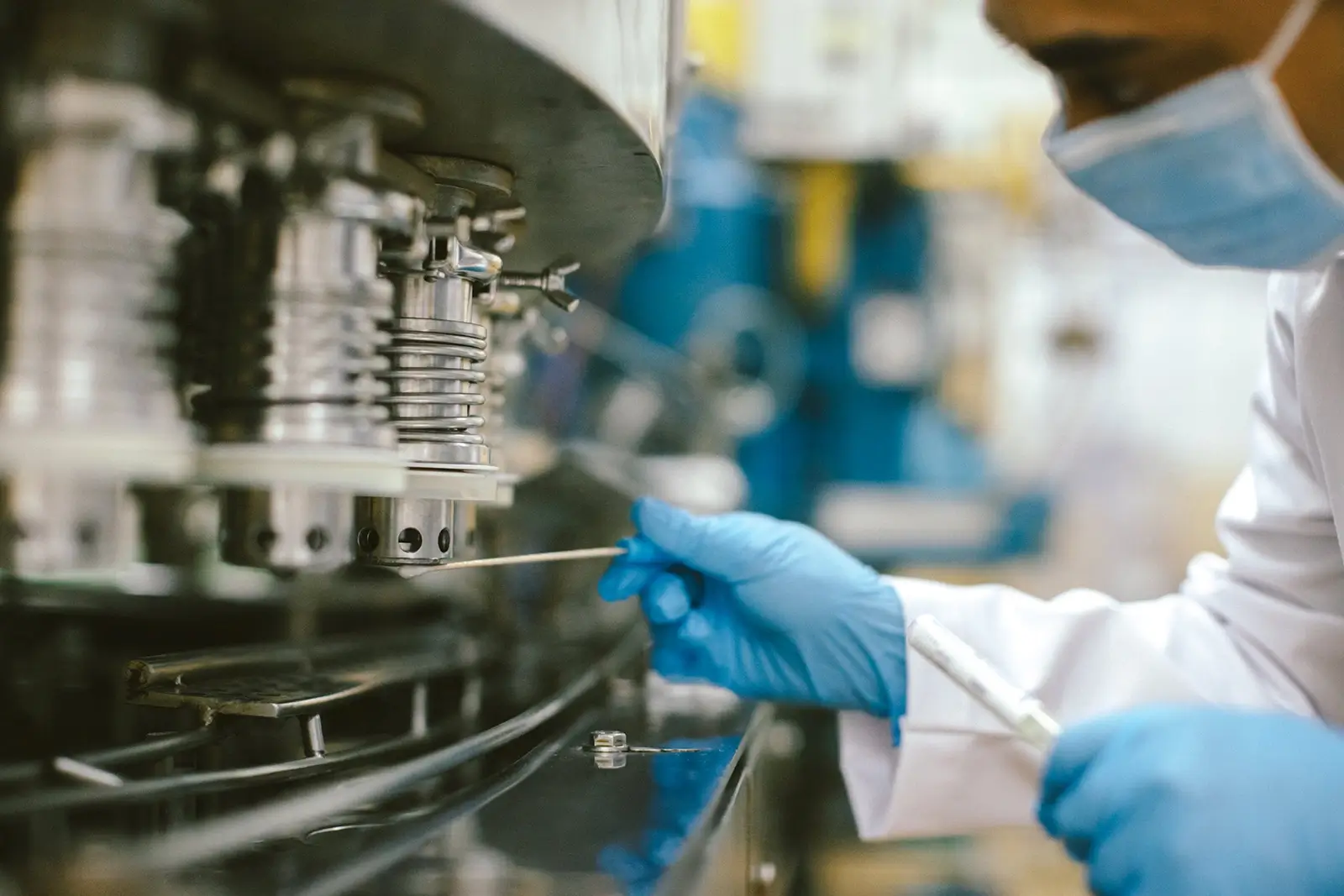 Hygiene Monitoring executive taking swab sample from machinery